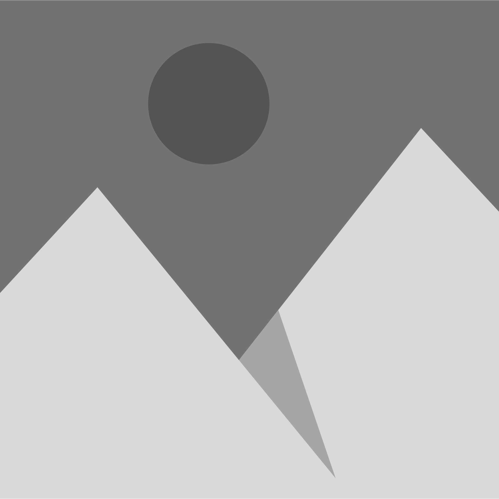 A group of mountains with a sun in the background.